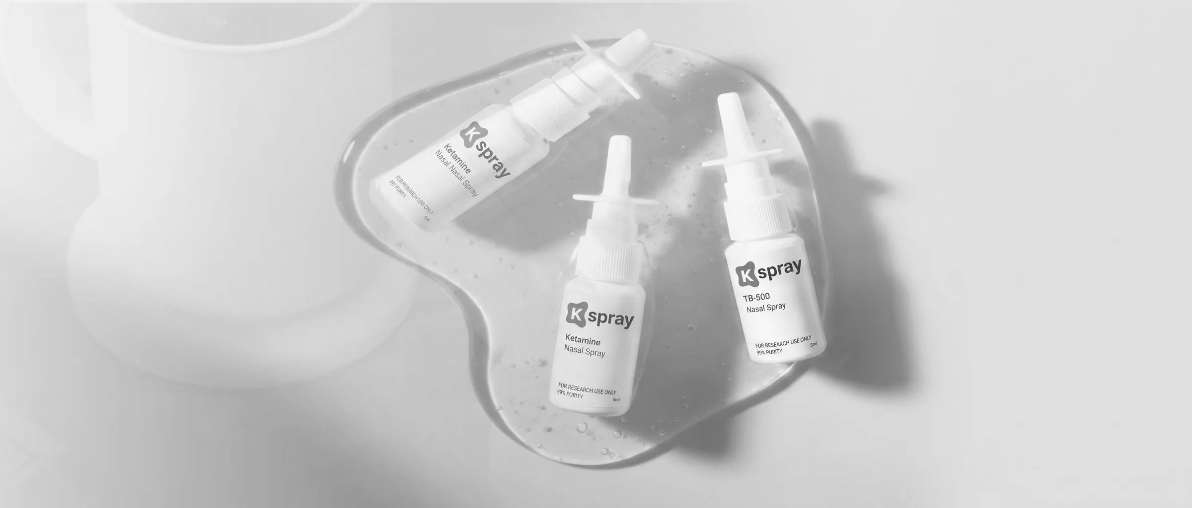 K-Spray nasal spray bottles arranged in a clinical product scene